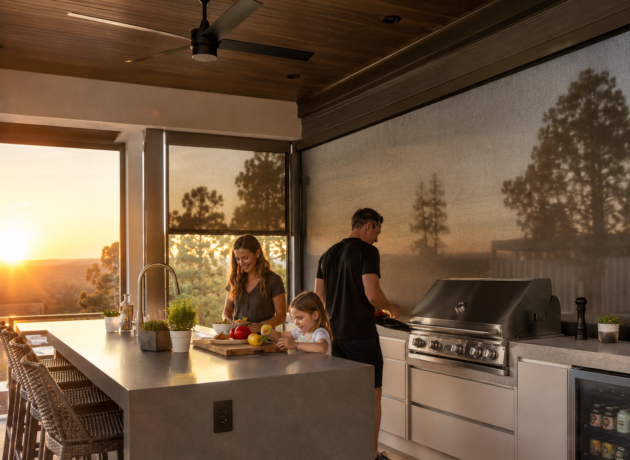 Motorized outdoor zip blinds installed around a luxury outdoor kitchen