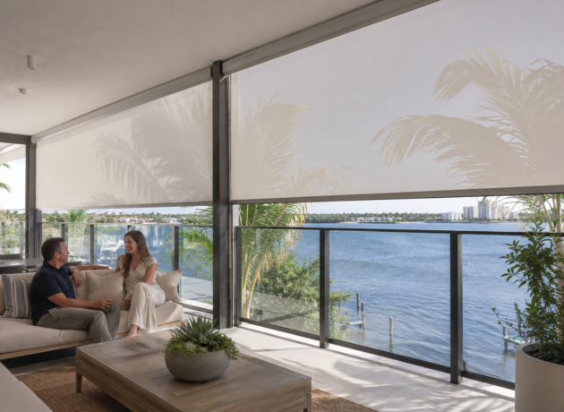 Outdoor zip blinds providing wind and sun protection on a modern balcony
