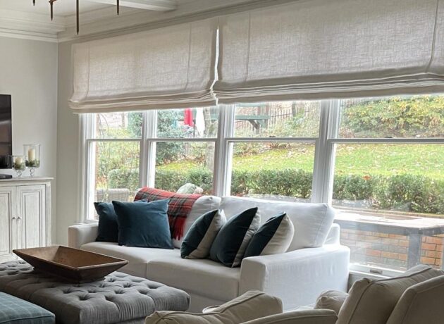 Elegant Roman shades installed in a contemporary living room