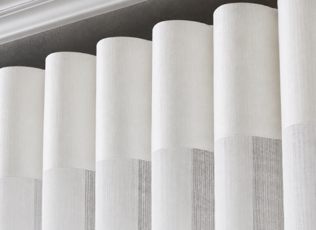 Soft pleats of ivory curtains