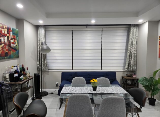 Custom zebra blinds providing light control in a modern dining room